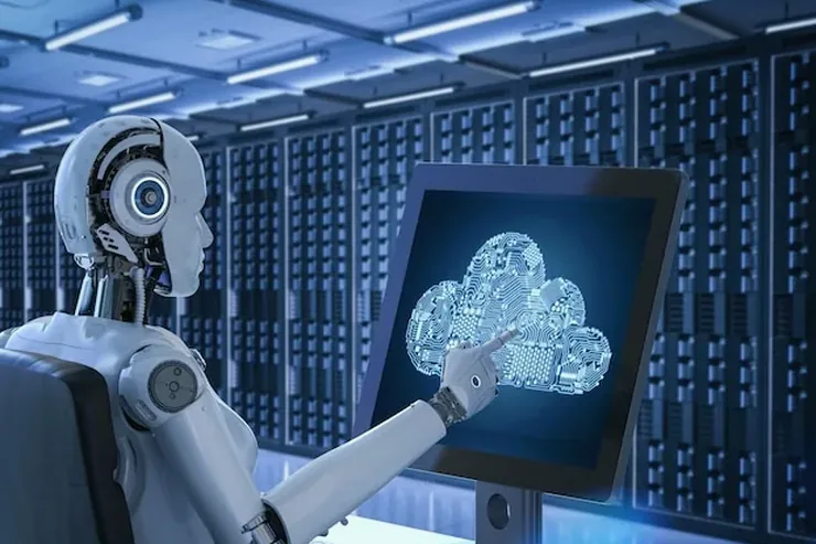 A humanoid robot working at a monitor in a server room